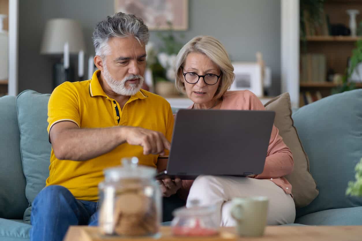 Couple completes end-of-life planning checklist on computer