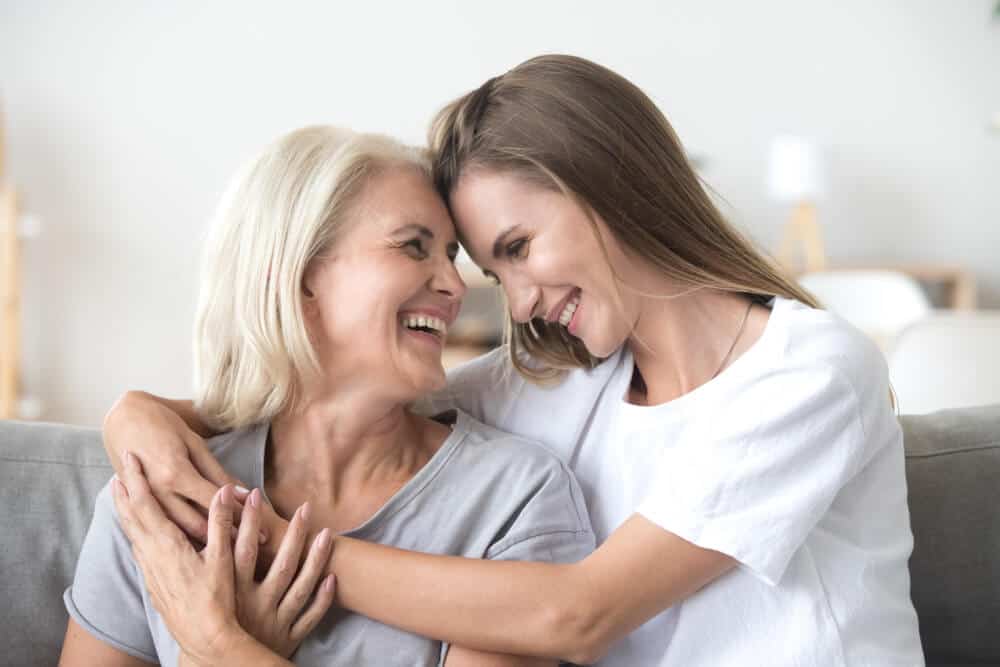 Younger woman hugs older woman - choosing a cremation provider in San Antonio, TX.