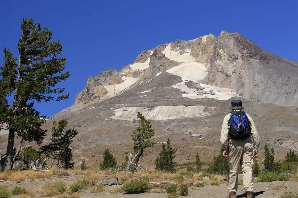 Man walking near Mount Hood - green cremation Oregon.